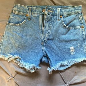 Wrangler vintage blue Jean shorts. (Size 27) Distressed blue Jean shorts.